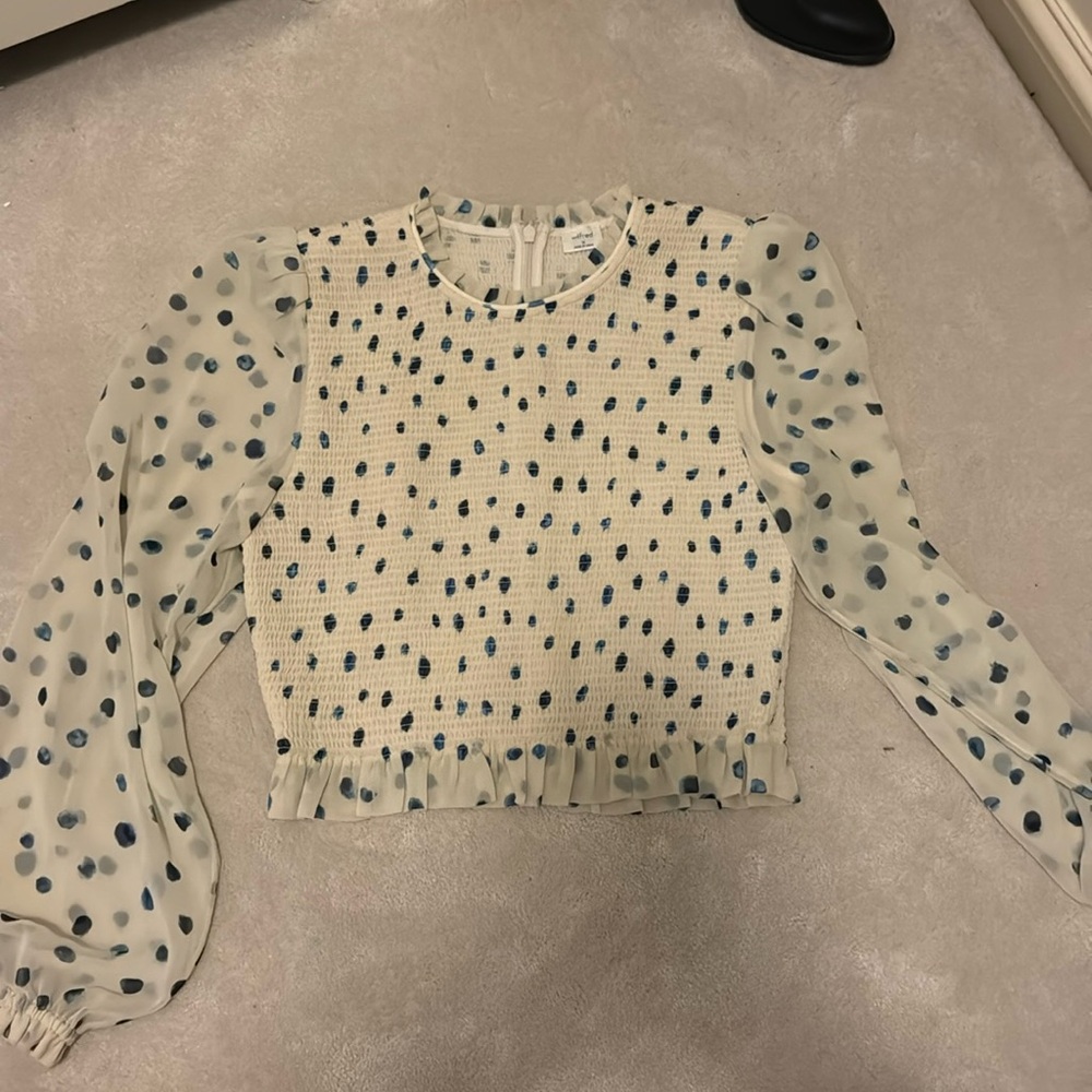 Ruched cropped white with blue polkadot blouse. Ruffle detail